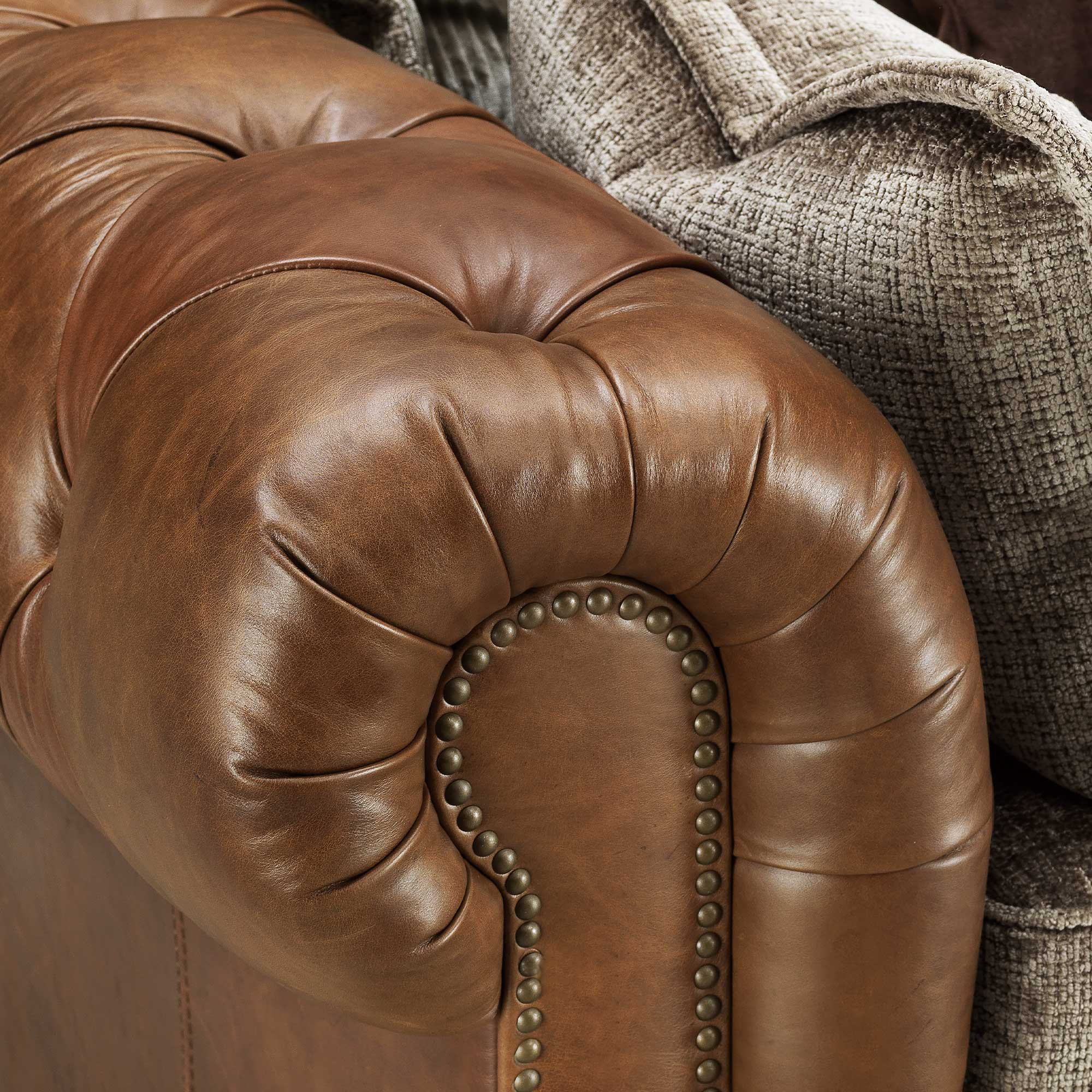 Taunton Brown Leather 3.5 Seater Sofa with Fabric Seat Cushions, In Roaming Valley body, Antique Brass Studs
